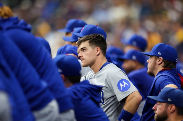 Cubs' Matt Shaw stands in the dugout during the ninth...