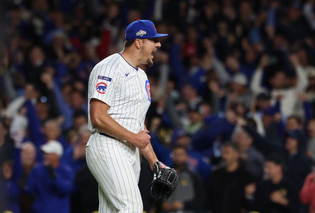 Cubs pitcher Brad Keller yells in celebration for a 4-3...