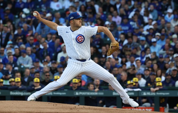 Cubs starter Jameson Taillon throws against the Brewers in the...