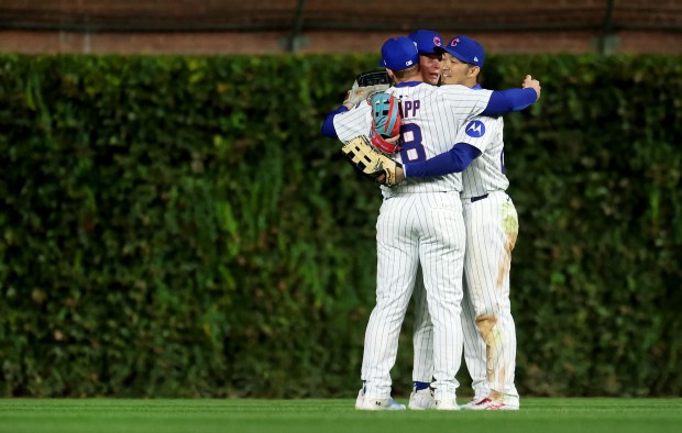 Chicago Cubs outfielders Ian Happ, Pete Crow-Armstrong and Seiya Suzuki...