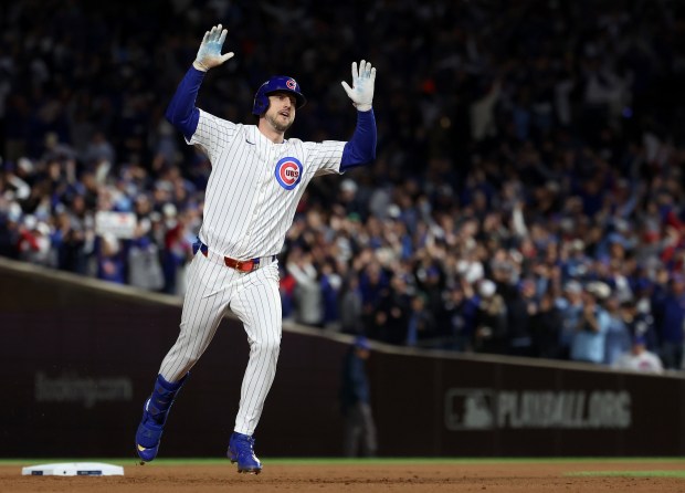 Cubs' Kyle Tucker celebrates after hitting a solo home run...