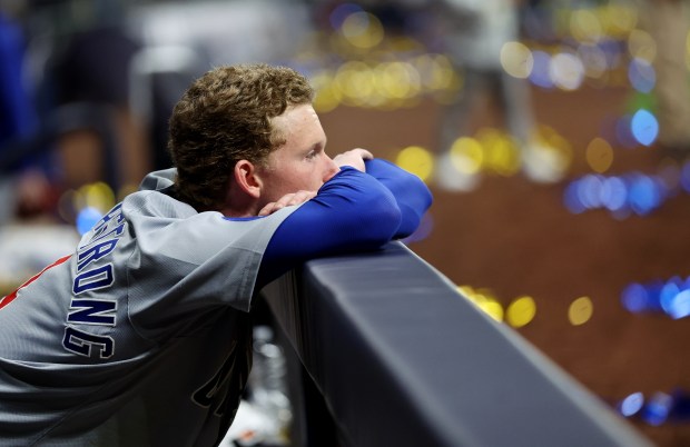 Cubs center fielder Pete Crow-Armstrong watches from the dugout as...