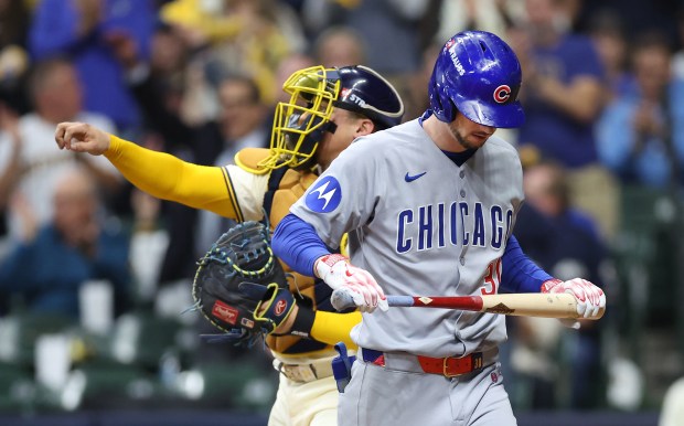 Chicago Cubs designated hitter Kyle Tucker (30) walks to the...