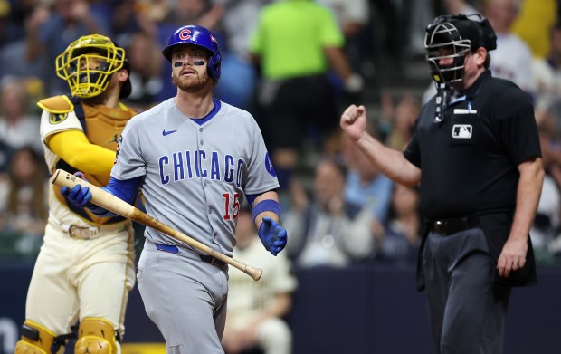Chicago Cubs catcher Carson Kelly walks to the dugout after...