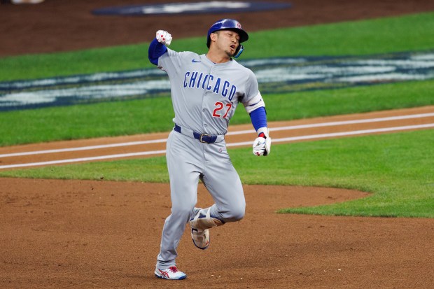 Chicago Cubs outfielder Seiya Suzuki (27) runs the bases after...