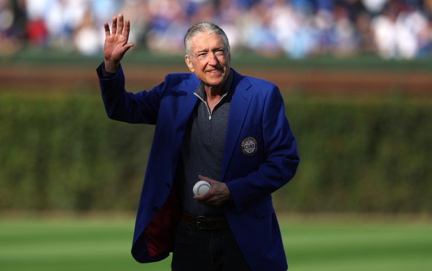 Chicago Cubs radio broadcaster Pat Hughes waves to the crowd...