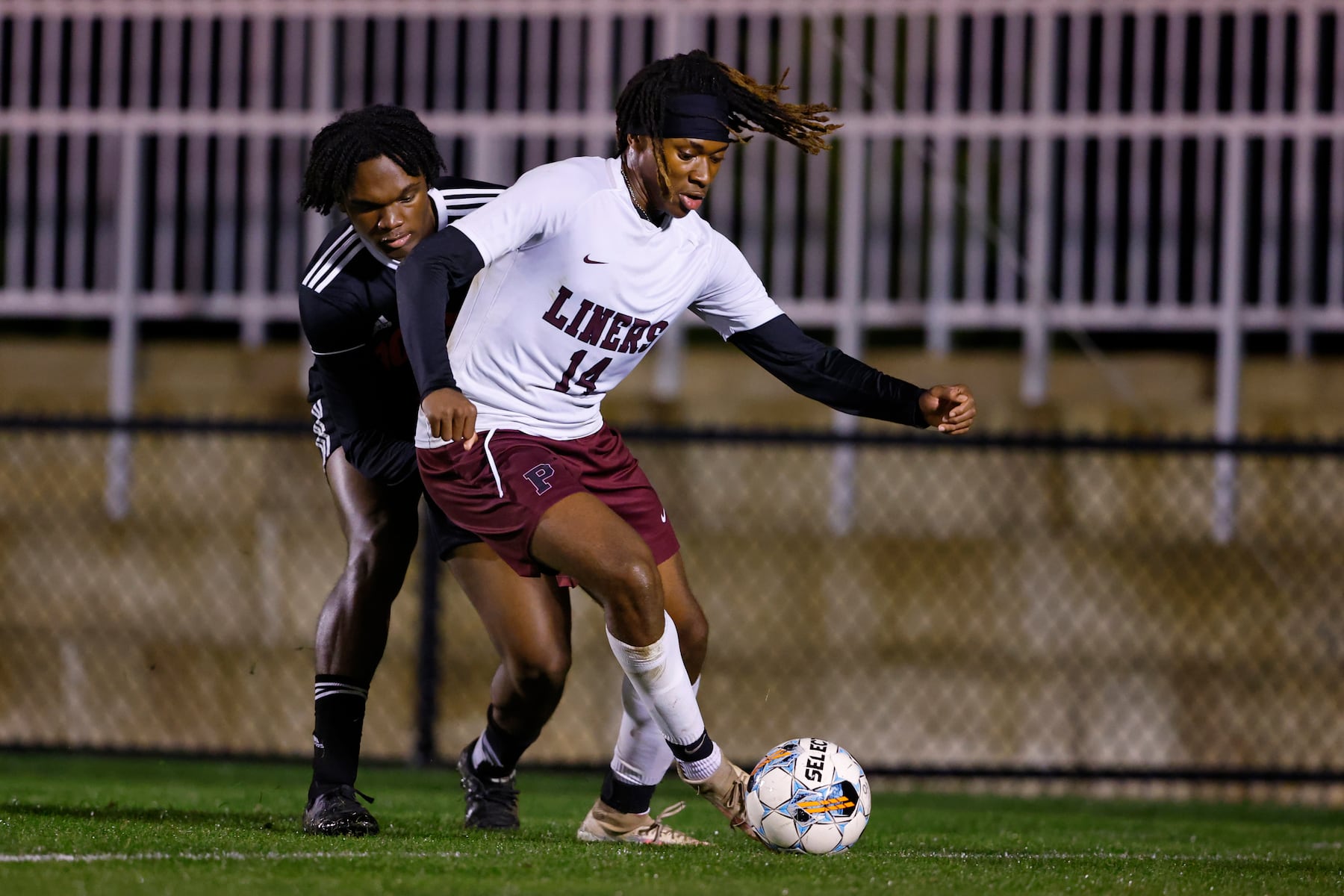 Phillipsburg's Christian Martin (14) battles Easton's Olufemi Baruwa (11) during a boy’s soccer match in Easton on Oct. 13 2025.