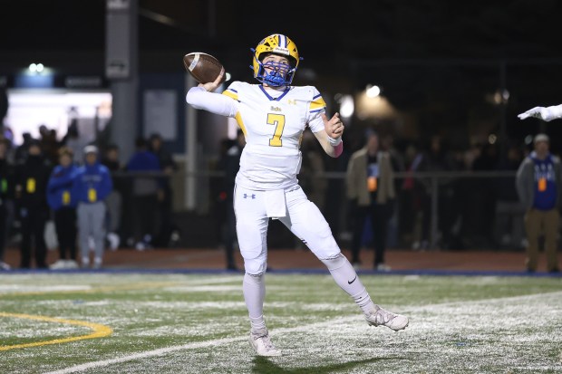 Sandburg's Sean Ruisz passes on the run against Lincoln-Way East on Thursday, Oct. 23, 2025, in Frankfort. (Gary Middendorf/for the Daily Southtown)