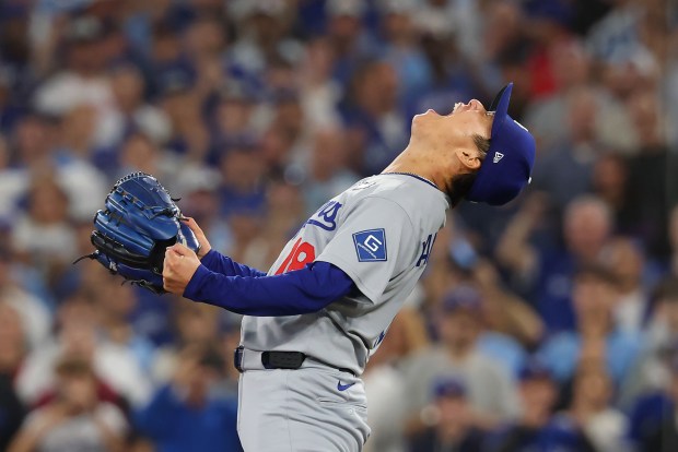 Dodgers pitcher Yoshinobu Yamamoto celebrates after getting the last out of a 5-4 win over the Blue Jays in Game 7 of the World Series on Saturday, Nov. 1, 2025, in Toronto. (Gregory Shamus/Getty Images)