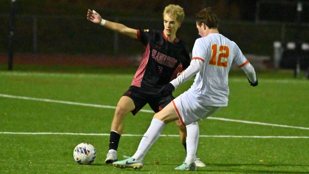 Glenelg's Colin Kryder and Fallston Noah Schmidt #12 battle for ball control during the Class 2A boys soccer state championship game at UMBC on Thursday. (Brian Krista/Staff)