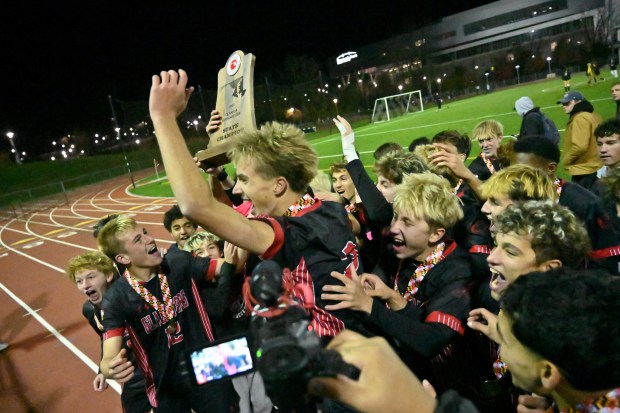 Glenelg celebrates their win over Fallston during the Class 2A boys soccer state championship game at UMBC on Thursday. (Brian Krista/Staff)