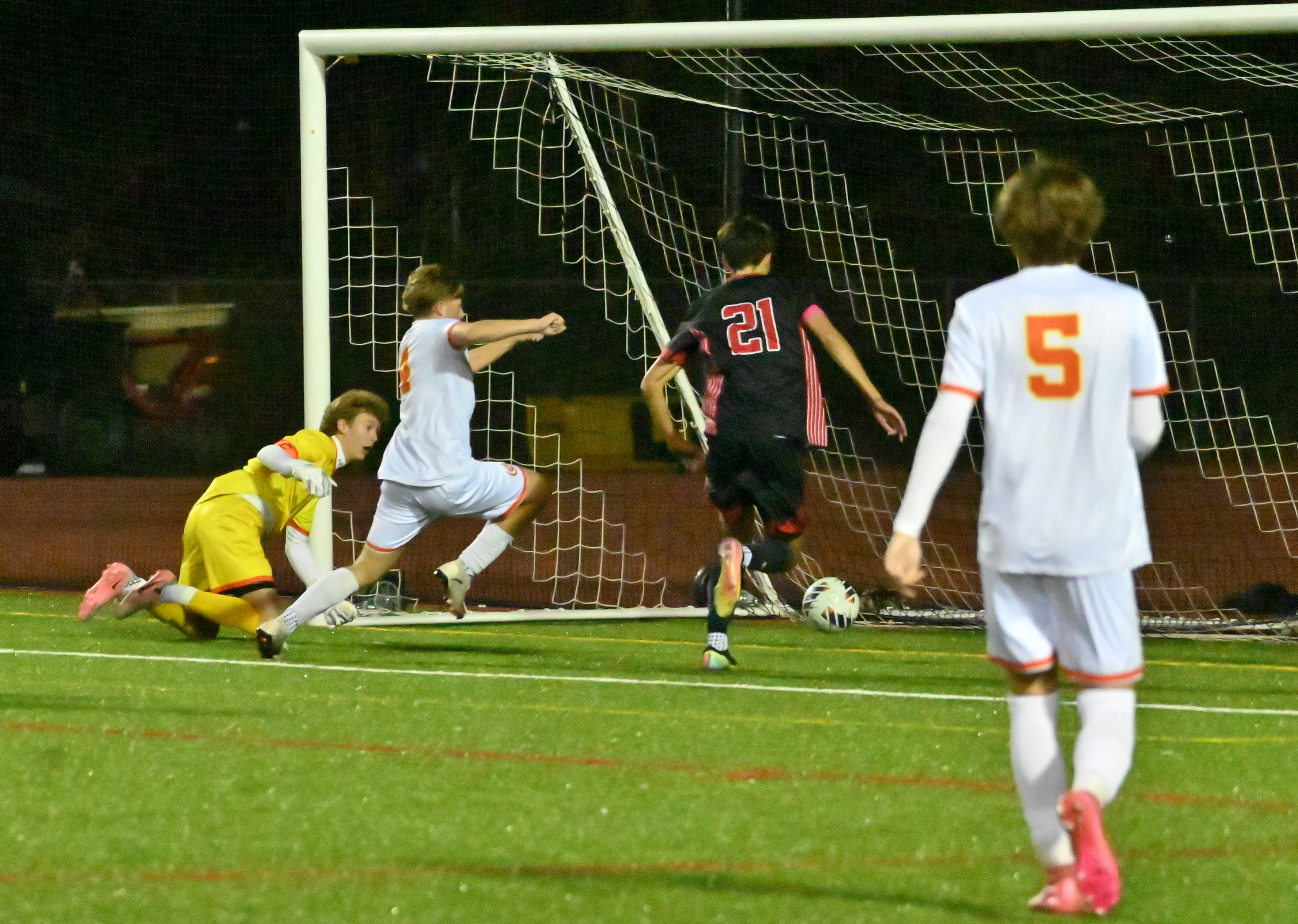 Glenelg's Alex Ball#21 gets to the rebound to score a goal against Fallston during the Class 2A boys soccer state championship game at UMBC on Thursday. (Brian Krista/Staff)