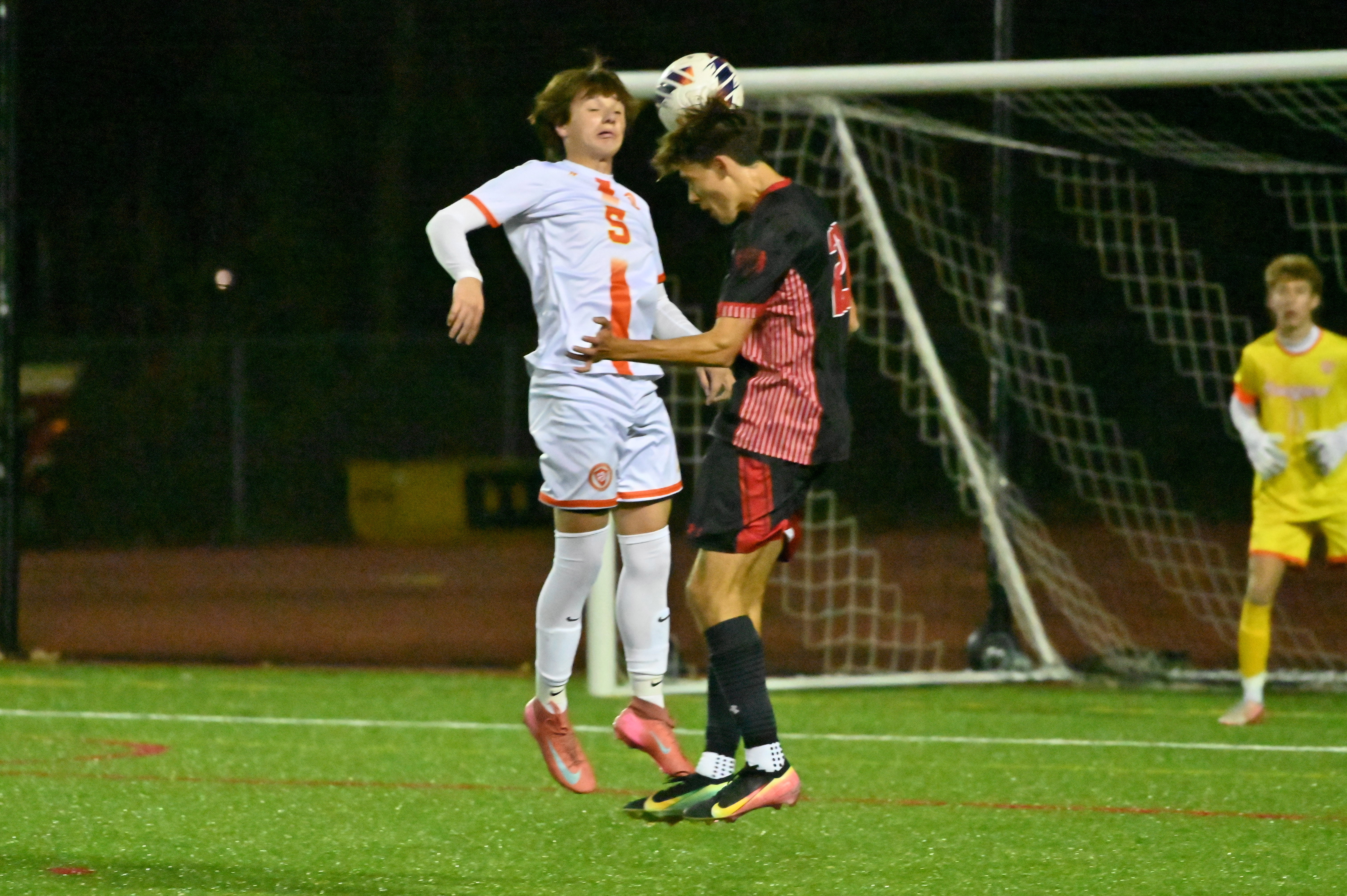 Fallston's Mason Judd, left, and Glenelg's Alex Ball contend for a header during the Class 2A boys soccer state championship game at UMBC on Thursday. (Brian Krista/Staff)