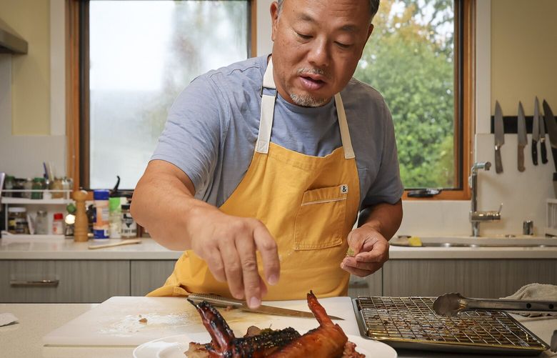 Taichi Kitamura puts the finishes touches on his  Thanksgiving teriyaki turkey at his home in Seattle, Washington, on October 24, 2025 231486