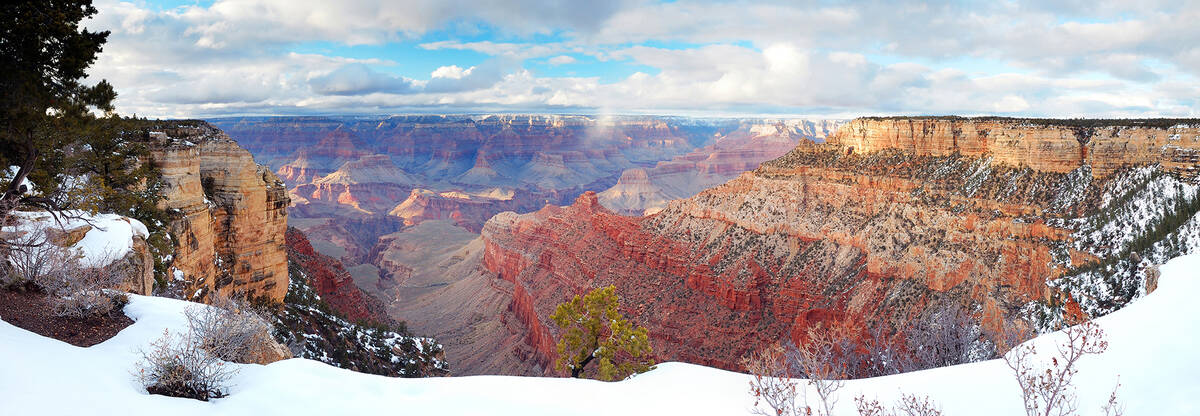 Grand Canyon panorama view in winter with snow and clear blue sky. (Getty Images)