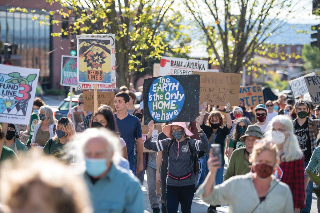Demonstrators marching up Main Street at the Stop Line 3 Rally in Burlington in 2021