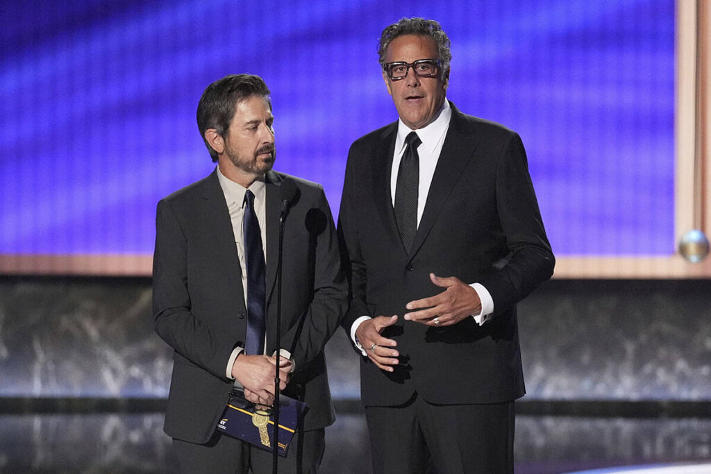 Ray Romano, left, and Brad Garrett present the award for outstanding comedy series during the 7 ...