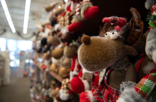 Decorative holiday items line the shelves at The Christmas Mouse, located at 1116 Atlantic Avenue, Suite 103, Monday, December 1, 2025. (Stephanie Kalis/For The Virginian-Pilot)