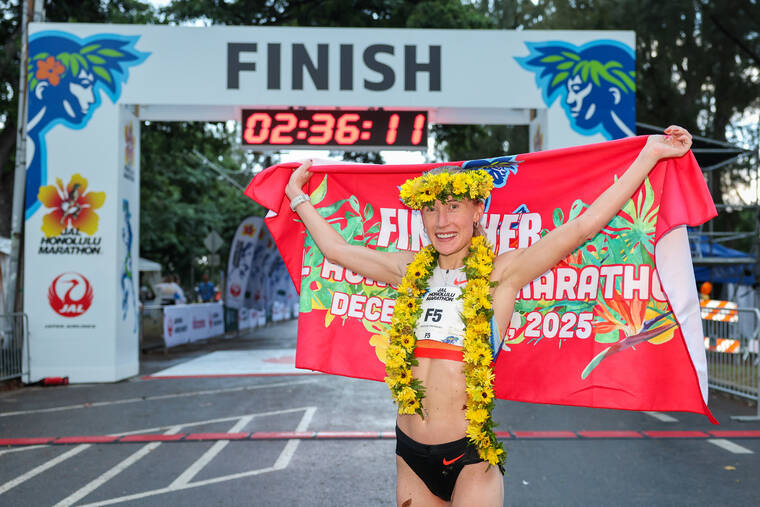 COURTESY HONOLULU MARATHON ASSOCIATION
                                Runner Calli Hauger-Thackery was crowned the first female finisher of the Honolulu Marathon today at Kapiolani Park.