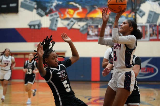 South Elgin's Taleah Banner (3) shoots the ball in the post against Elgin's Trinity Riggins (5) during a Upstate Eight Conference game in South Elgin on Tuesday, Dec. 16, 2025. (Sean King / For The Beacon-News)