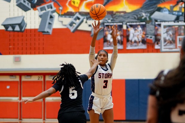 South Elgin's Taleah Banner (3) launches a 3-pointer from the arc over Elgin's Trinity Riggins (5) during a Upstate Eight Conference game in South Elgin on Tuesday, Dec. 16, 2025. (Sean King / For The Beacon-News)