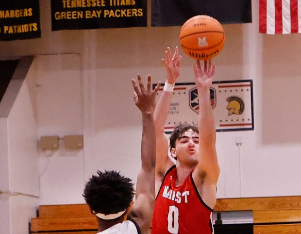 Marist's Adoni Vassilakis shoots from the top of the key against Marian during an East Suburban Catholic Conference basketball game in Chicago Heights on Friday, Dec. 19, 2025. (John Smierciak/Daily Southtown)