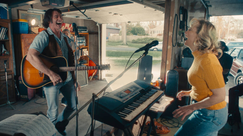 This image released by Focus Features shows Hugh Jackman and Kate Hudson, right, in a scene fro ...