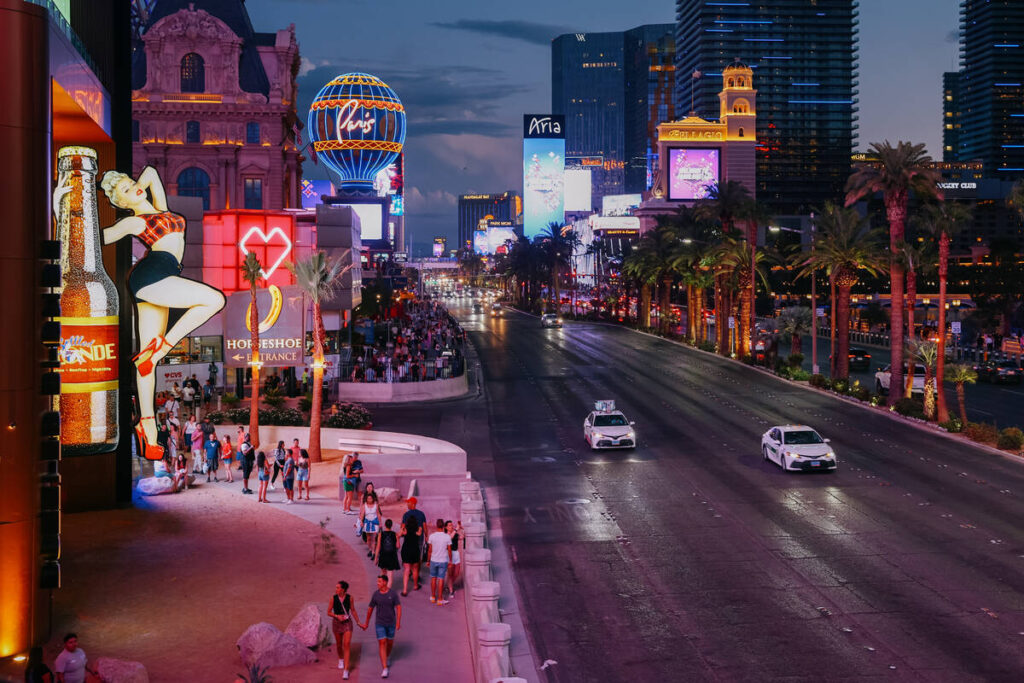 The street is awash in purple and pink hues along the Strip on Thursday, Sept. 4, 2025 in Las V ...