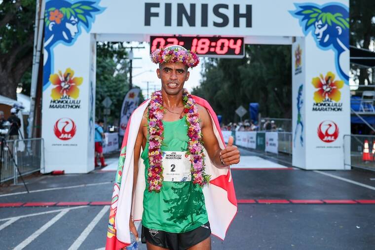 COURTESY HONOLULU MARATHON ASSOCIATION
                                Runner Tuemay Weldlibanos won the Honolulu Marathon finishing at Kapiolani Park today with a time of 2 hours and 13.38 minutes.