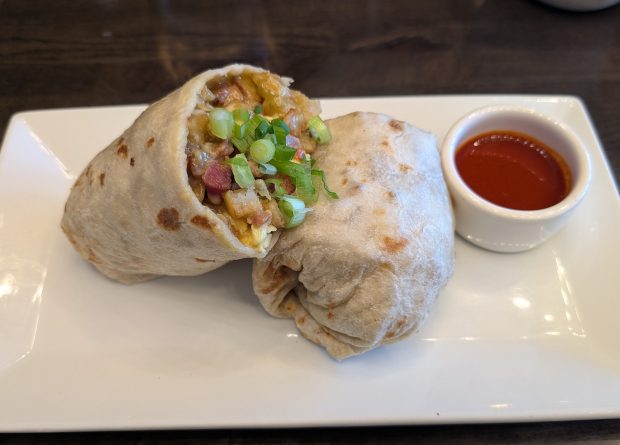 The breakfast burrito with sausage at Onefold, a breakfast restaurant at 1420 E. 18th Ave., Denver. (Miguel Otarola/The Denver Post)