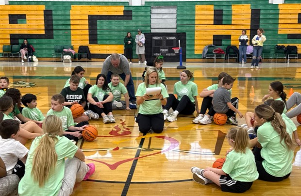 Campers and their buddies gather around Providence girls assistant basketball coach Jenny Maziur Friday, Jan. 2, 2026, at the Super Celtics camp. (Jeff Vorva/for the Daily Southtown)