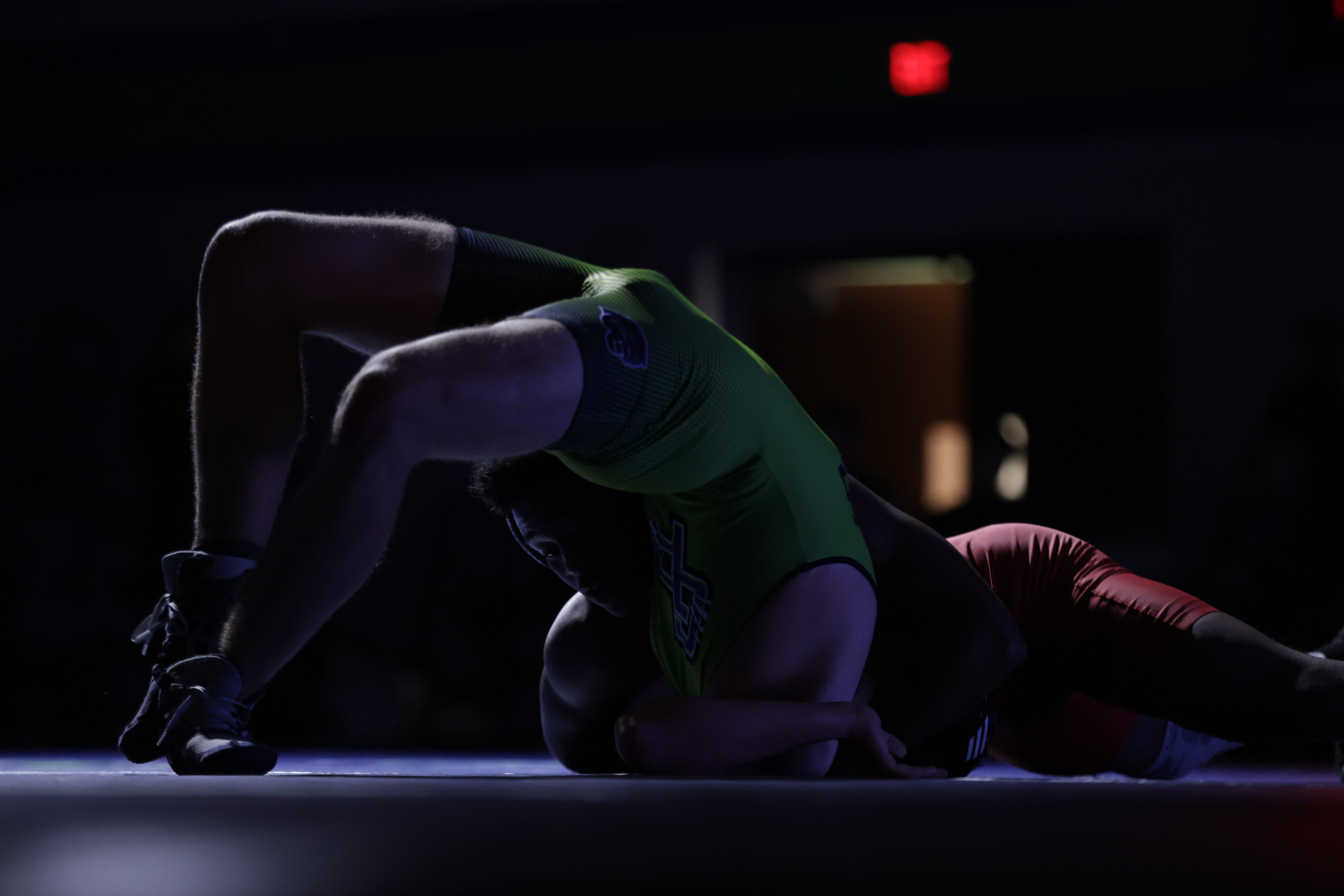 Guilford Parkâs Colby Carnahan fights off a pin attempt by...
