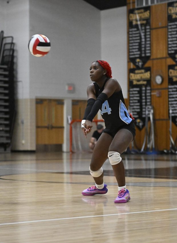 Westminster's Trinity Nelson bumps the ball during a volleyball game at South Carroll High School. (Thomas Walker/Freelance)