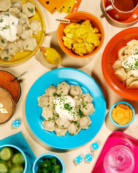 a variety of dumplings on colorful dishware