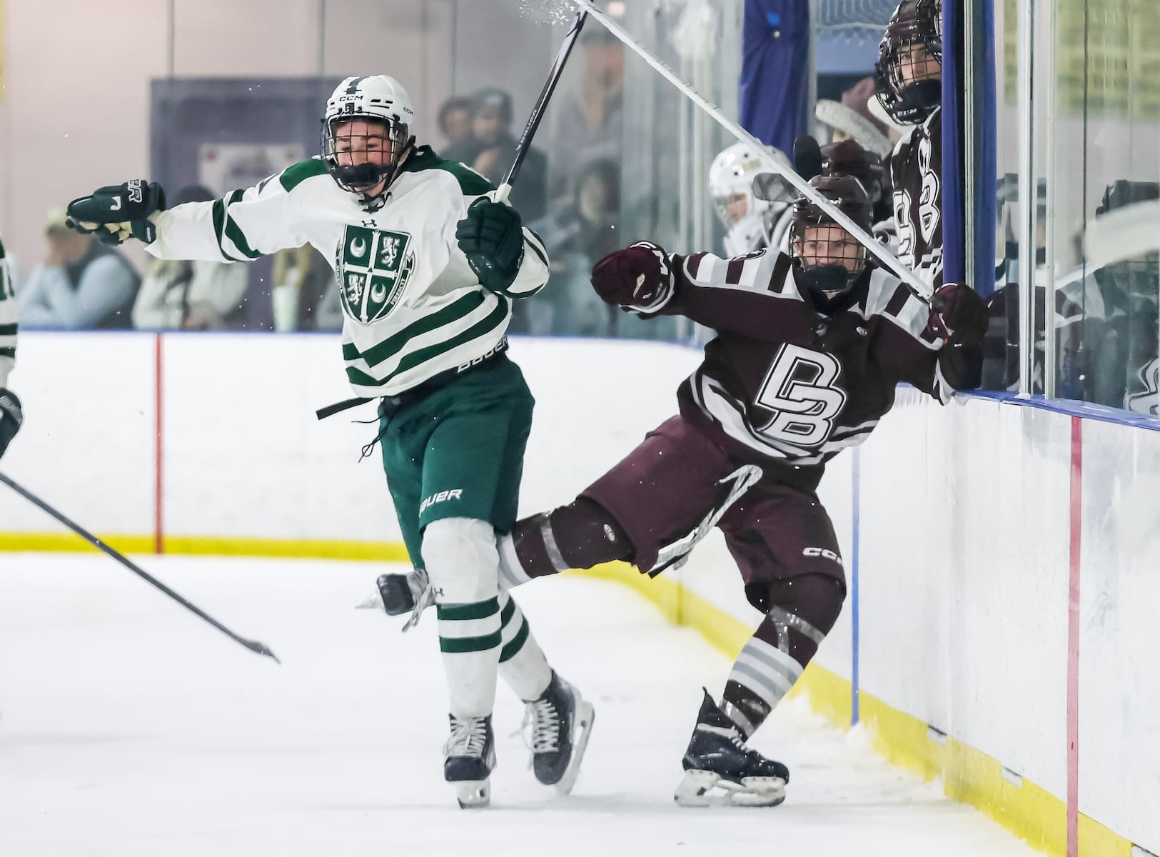 Michael Pirot (21) of Delbarton chess Peyton Murphy (8) of Don Bosco Prep into the boards during the ice hockey game at Ice Vault Arena in Wayne, NJ On Sunday, January 11, 2026.