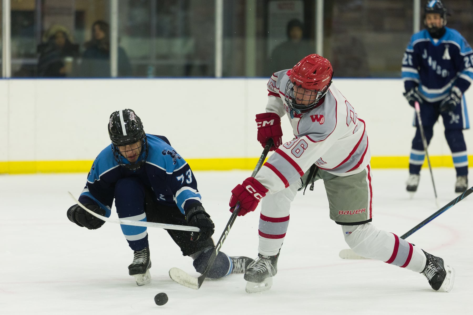 Gage Angley of Hoboken (36) tries to shoot the puck past Jack Goldate of A.L. Johnson (73) in Sunday's high school boys ice hockey showdown in Roselle. Johnson out-skated the Redwings 4-1.  01/11/2026
