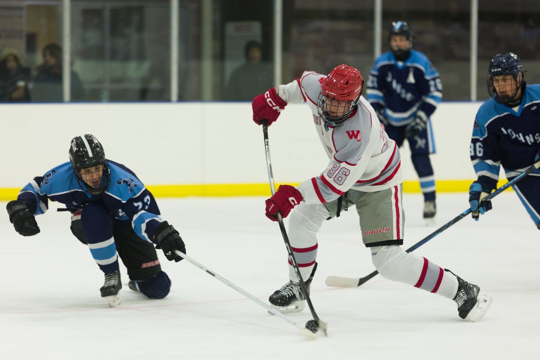 Gage Angley of Hoboken (36) tries to shoot the puck past Jack Goldate of A.L. Johnson (73) in Sunday's high school boys ice hockey showdown in Roselle. Johnson out-skated the Redwings 4-1.  01/11/2026