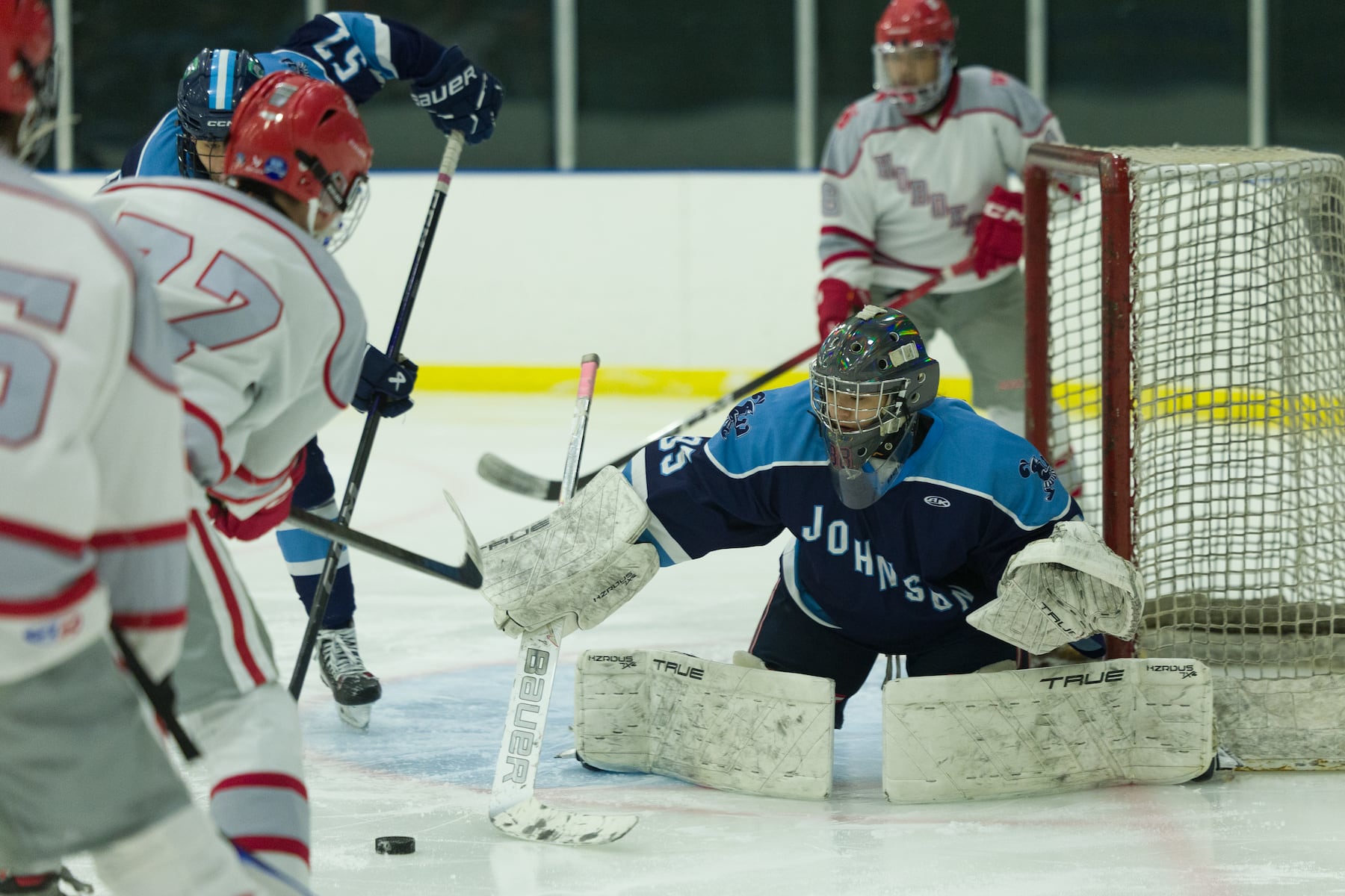 A.L. Johnson goalie Gia Amores (35) makes the save against Hoboken in Sunday's high school boys ice hockey showdown in Roselle. Johnson out-skated the Redwings 4-1.  01/11/2026