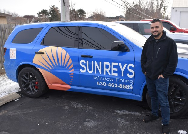 Gilbert Ramirez started his window tinting company in Naperville five year ago after learning the trade. He also offers vehicle wrapping and paint protection. (Steve Metsch/Naperville Sun)