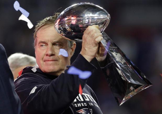 New England Patriots head coach Bill Belichick holds up the Vince Lombardi Trophy as he celebrates the Patriots' victory over the Seattle Seahawks in NFL Super Bowl XLIX football game Feb. 1, 2015, in Glendale, Ariz. (AP Photo/Patrick Semansky)