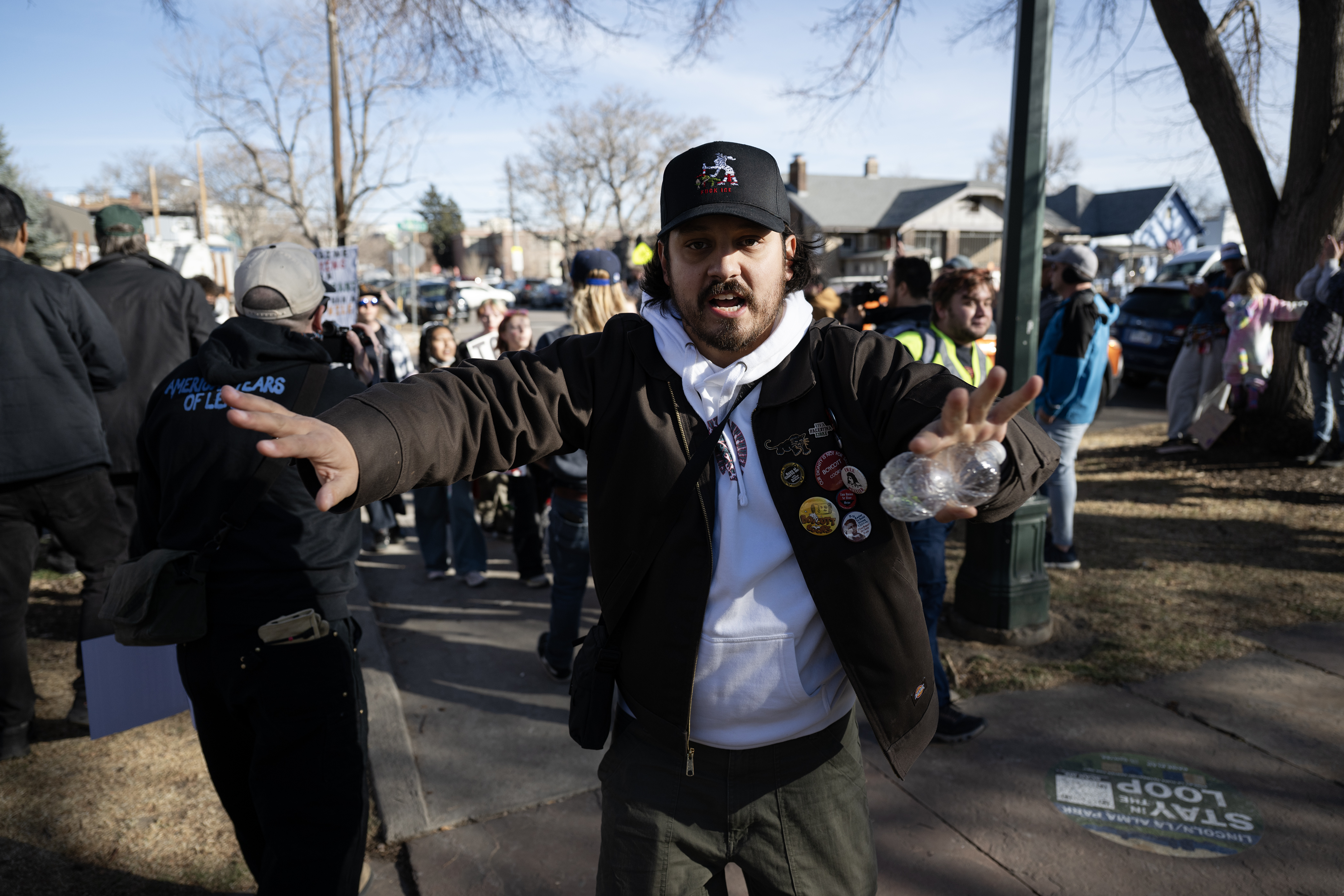 Former Colorado State Representative Tim HernÃ¡ndez clears a path as...