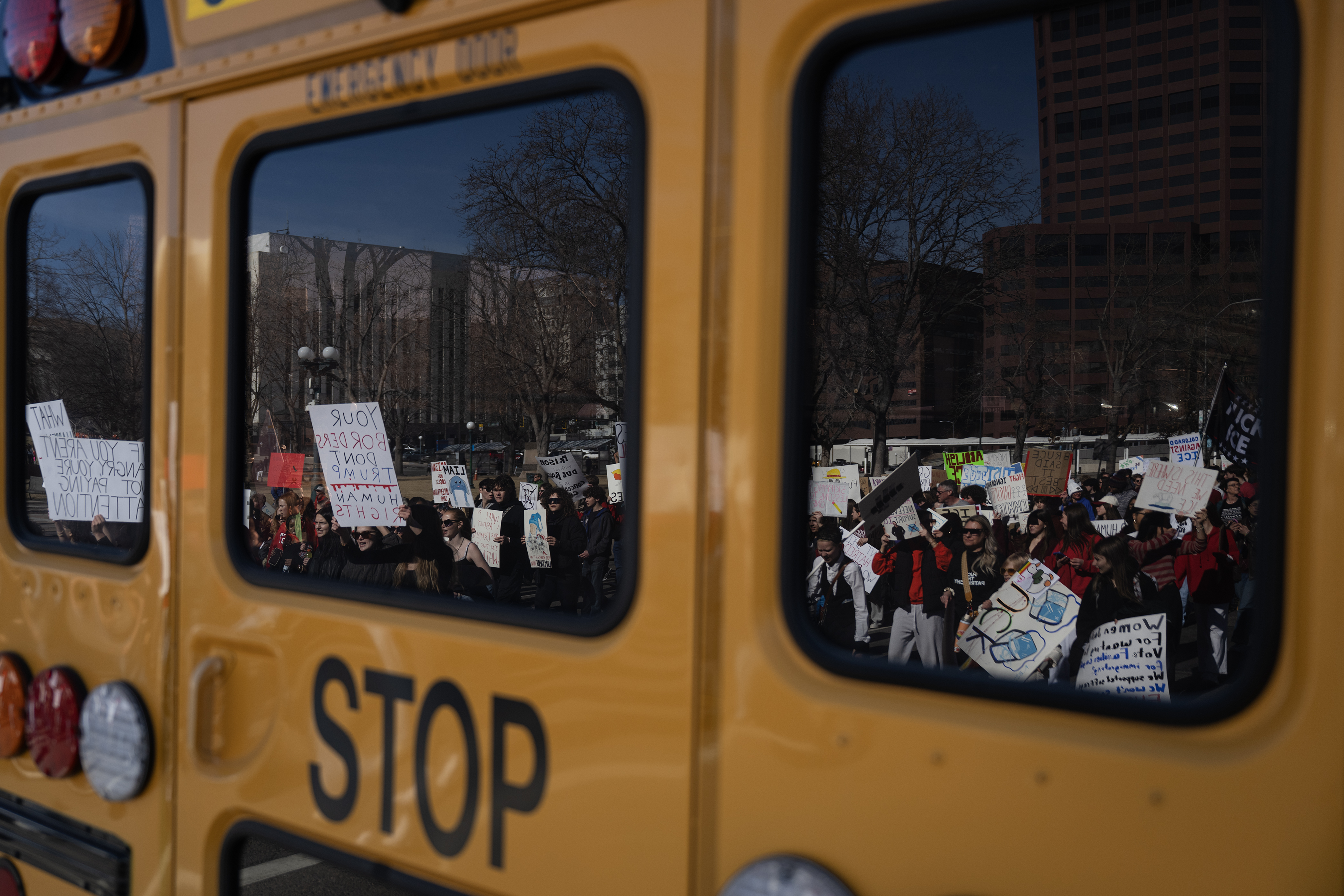 Students and other protestors march down Broadway as part of...