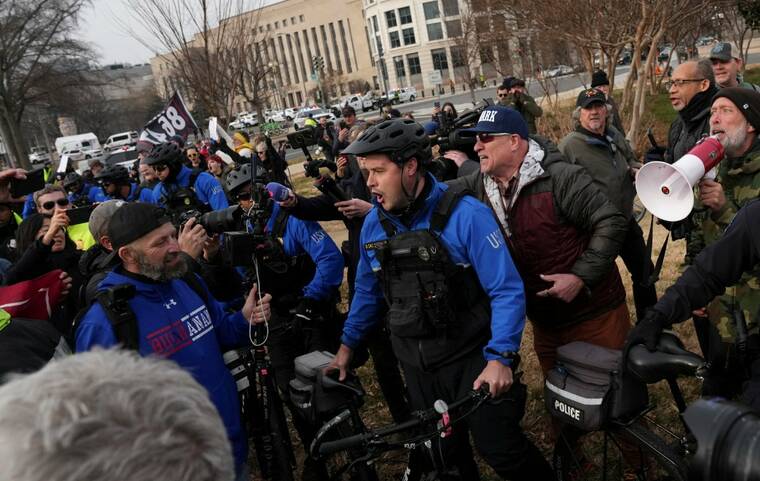 REUTERS/LEAH MILLIS
                                Defendants, supporters, relatives and friends marching from The Ellipse to the U.S. Capitol in memory of those who died on, or in the aftermath, of the January 6, 2021, attack on the U.S. Capitol, are faced by counter-protesters on the fifth anniversary of the attack in Washington, D.C., today.