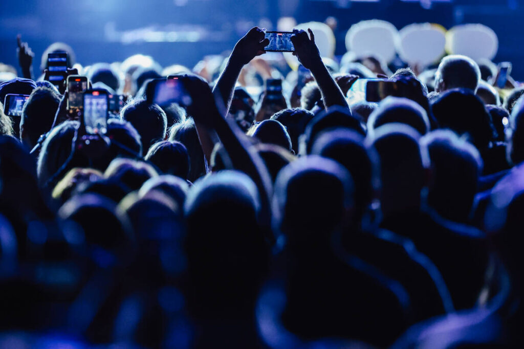 Fans record on their phones as Paul McCartney performs during a stop on his Got Back tour at Al ...