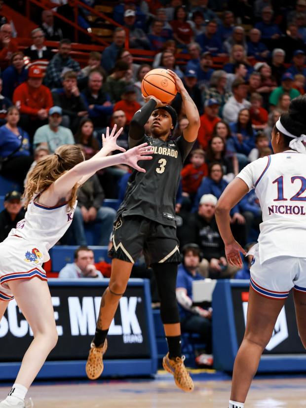 Colorado's Desiree Wooten, center, puts up a shot in front of Kansas defenders during a game at Allen Fieldhouse in Lawrence, Kansas, on Feb. 1, 2026. (CU Athletics)