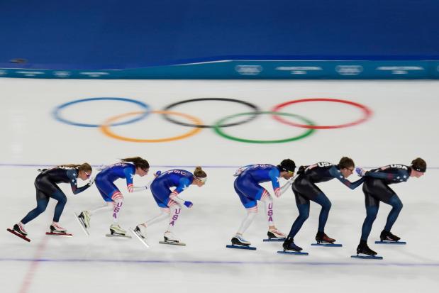 United States' women's and men's team pursuit speed skaters warm up, at the 2026 Winter Olympics