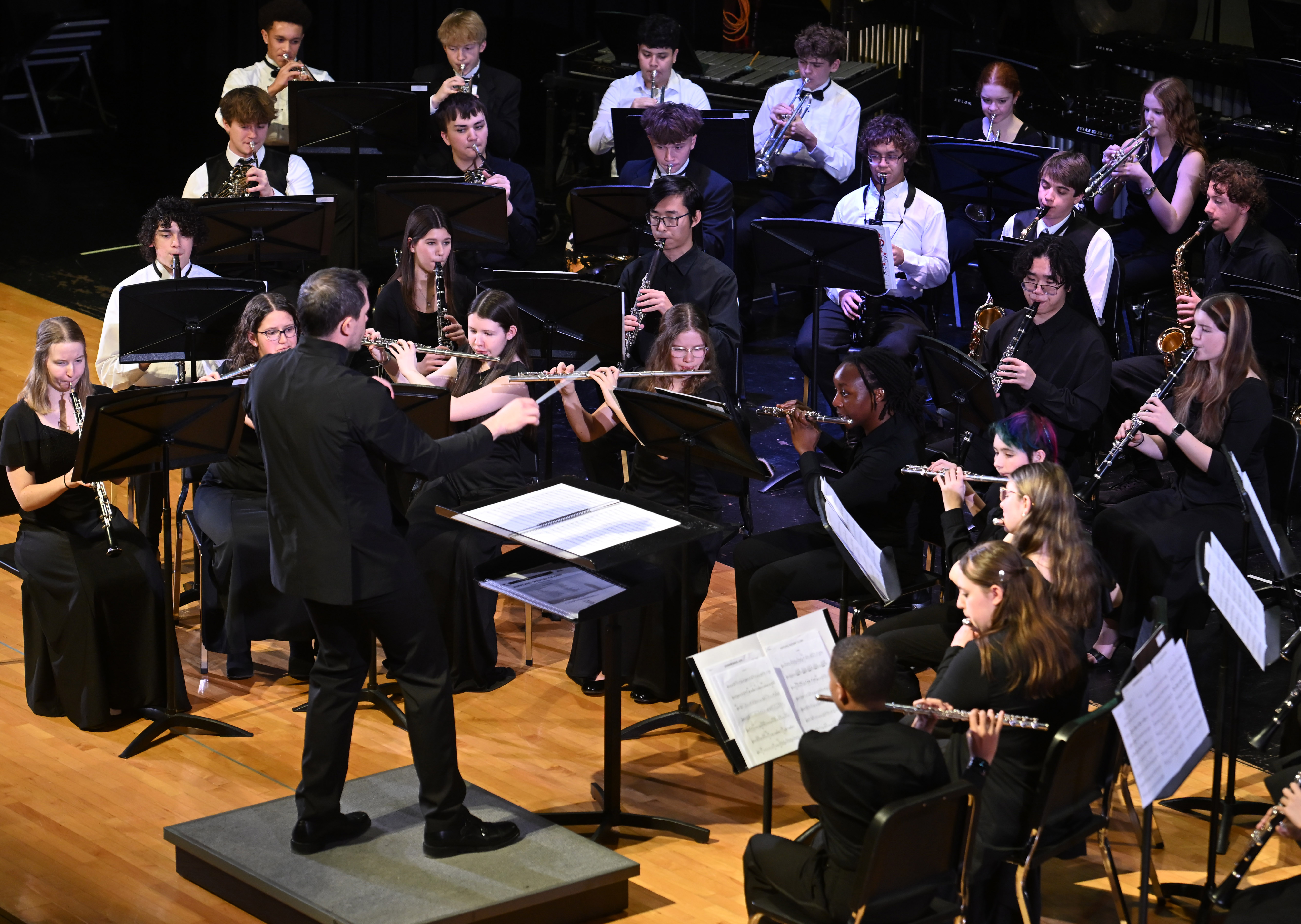 Guest conductor Dr. Branden Steinmetz, Director of Band at Towson University, leads the student musicians from the seven high schools in Carroll County Public Schools during the All County High School Band concert at Manchester Valley High School on Saturday. (Brian Krista/Staff)