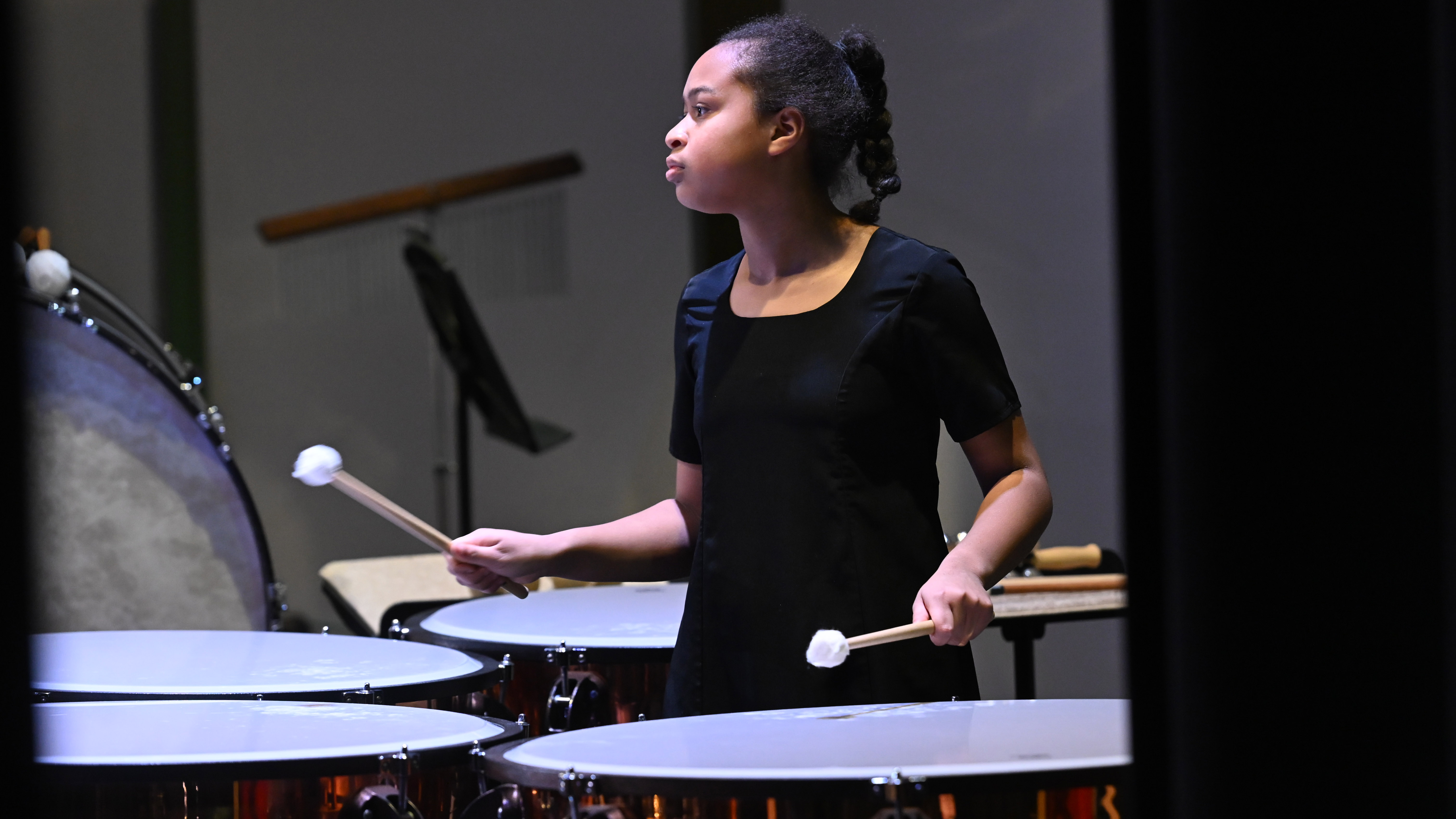 Ella Harley of Sykesville Middle plays the timpani with fellow students musicians from the eight middle schools in Carroll County Public Schools during the All County Middle School Band concert at Manchester Valley High School on Saturday. (Brian Krista/Staff)