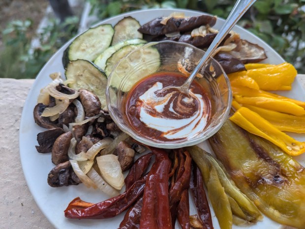 A platter of roasted vegetable is served with Pepper-Swirled Tahini. (Photo by Yakir Levy)