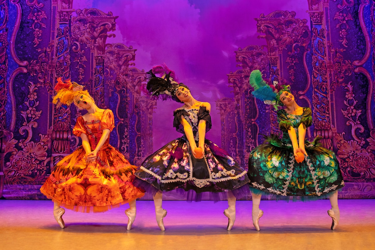 A ballet company performs on stage